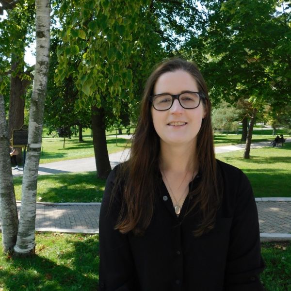 Brittany Menard in front of trees