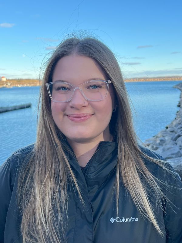 Celina White in front of the Kingston harbour front