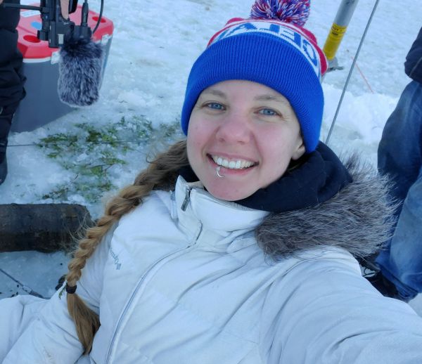 Monica doing research outside in a snowy location