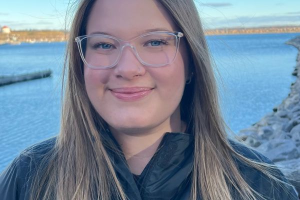 Celina White in front of the Kingston harbour front
