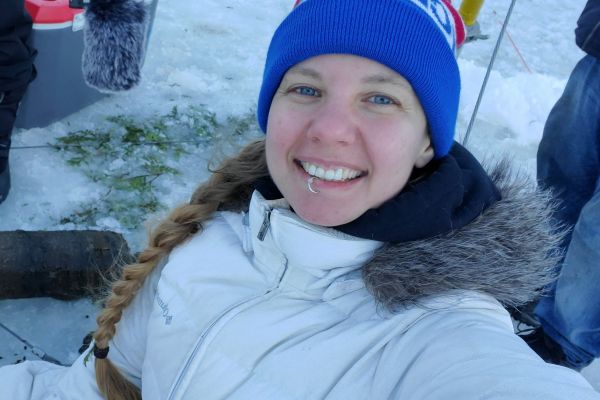 Monica doing research outside in a snowy location